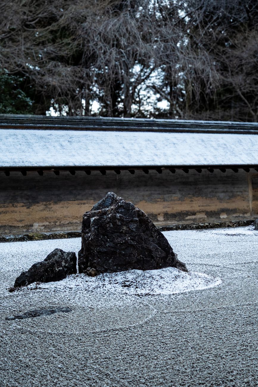Serene Japanese garden in northern Kyoto with raked gravel and stone lanterns